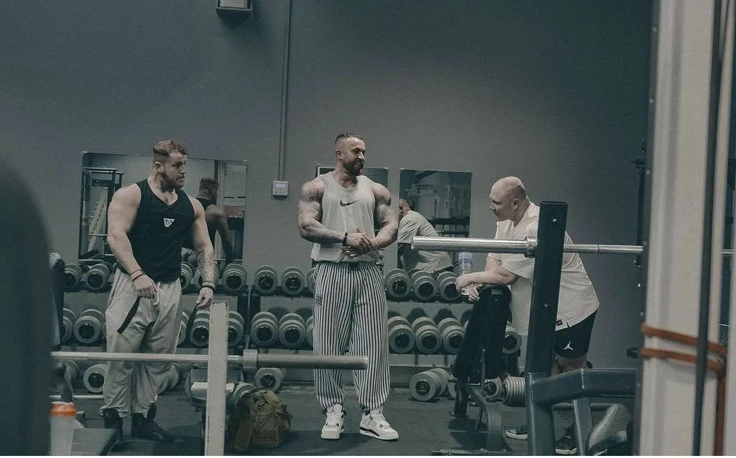 Members and coaches on the House of Gainz training floor
